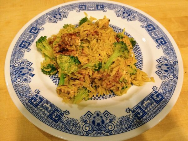 Plate of orzo with broccoli and chicken